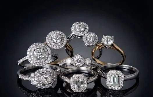 Classic diamond solitaire and halo rings in white and yellow gold
